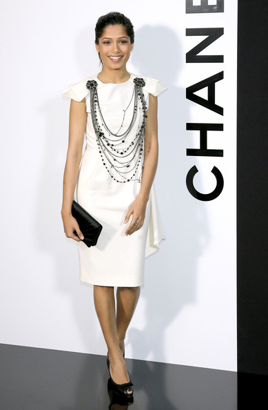 The Dust hasn't settled at the slums of Mumbai but Freida looks settled in the high rises!