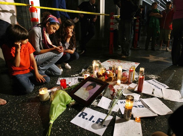 Candles, flowers and notes are seen on the pop star on the Walk of Fame inHollywood, California
